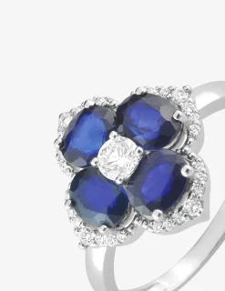 Bague fleur or blanc 375‰, saphir et oxydes de zirconium SO OR