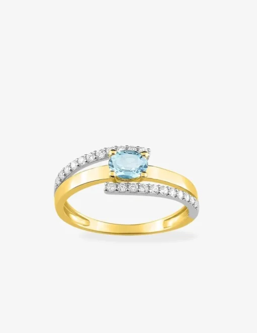 Bague monture bicolore or 750‰, topaze bleue traitée et oxydes de zirconium SO OR