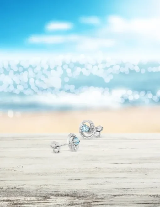 Boucles d'oreilles clous or blanc 375‰ et topaze SO OR