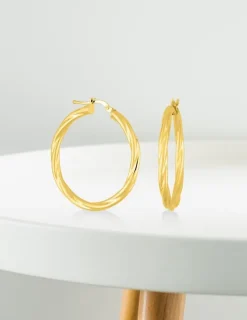 Boucles d'oreilles créoles torsadées en or jaune 375 ‰ SO OR