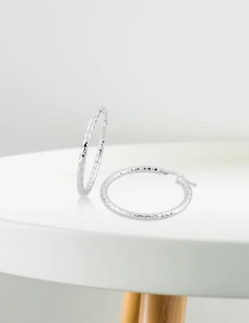 Boucles d'oreilles créoles diamantées en or blanc 375 ‰ SO OR