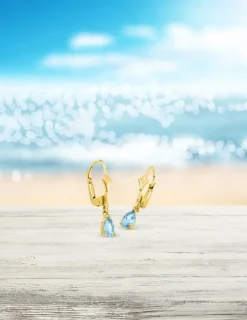 Boucles d'oreilles dormeuses or jaune 375‰ et topaze bleue SO OR
