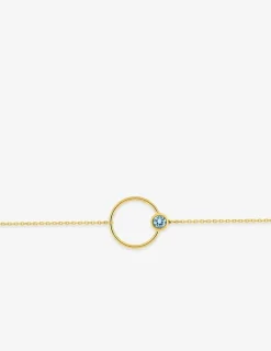 Bracelet cercle en or jaune 375‰ et topaze bleue SO OR