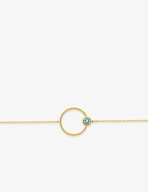 Bracelet cercle en or jaune 375‰ et topaze bleue SO OR