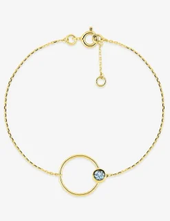 Bracelet cercle en or jaune 375‰ et topaze bleue SO OR