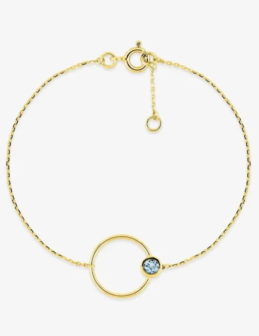 Bracelet cercle en or jaune 375‰ et topaze bleue SO OR