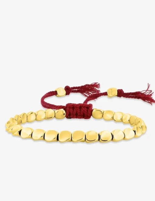 Bracelet cordon rouge avec des détails en cuivre doré SO OR