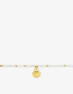 Bracelet en acier doré, cristal blanc synthétique et breloque coquillage SO OR