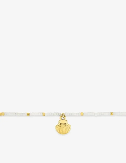Bracelet en acier doré, cristal blanc synthétique et breloque coquillage SO OR