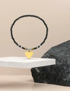Bracelet élastique cristal noir et motif cœur acier doré SO OR