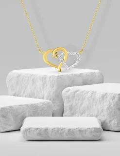 Collier cœurs entrelacés oxydes de zirconium en or jaune 375 ‰ et rhodium SO OR