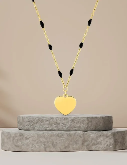Collier pendentif fantaisie noir et acier doré, motif plaque cœur SO OR