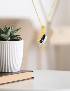 Pendentif rubans or jaune 375‰ et saphir SO OR