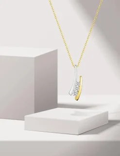 Pendentif virgule or jaune 375 ‰ et rhodium avec oxydes de zirconium SO OR