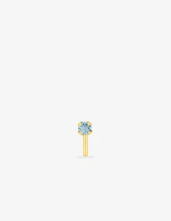 Piercing de nez or jaune 750 ‰ et topaze bleue traitée SO OR