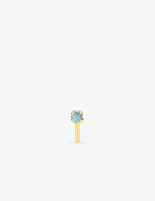 Piercing de nez or jaune 750 ‰ et topaze bleue traitée SO OR